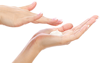 image of hands being moisturised image of hands being moisturised