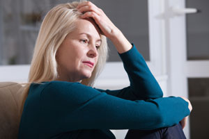 sad-depressed-woman-home-sitting