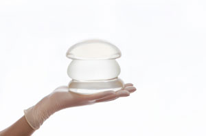 silicone-breast-implant-on-hands