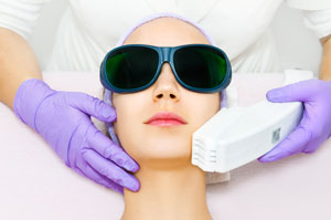 young-woman-receiving-laser-treatment young-woman-receiving-laser-treatment